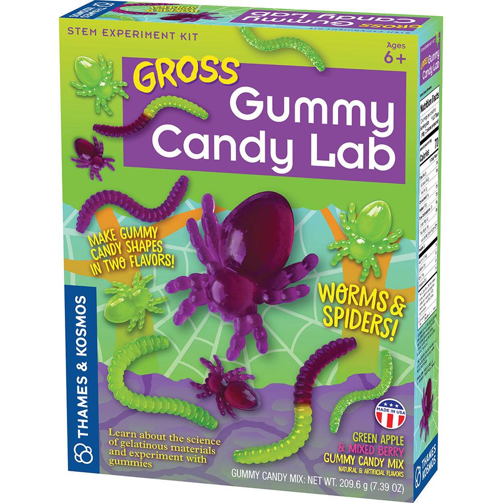 A lime green colored box with purple and green gummy spiders and worms all over the box.