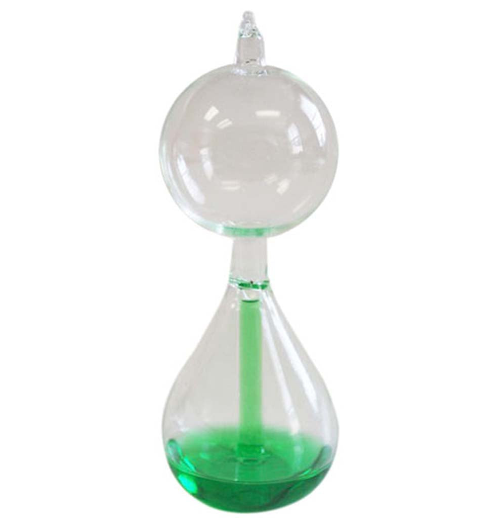 A glass sculptural shape hand boiler with green liquid in the bottom and partially in the bottom tube.