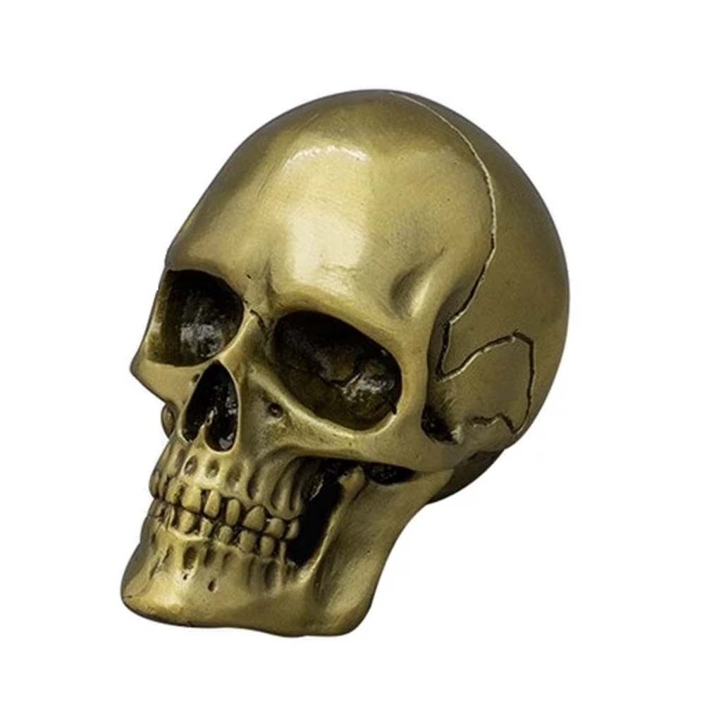 An anatomically correct smooth skull with a gold finish.