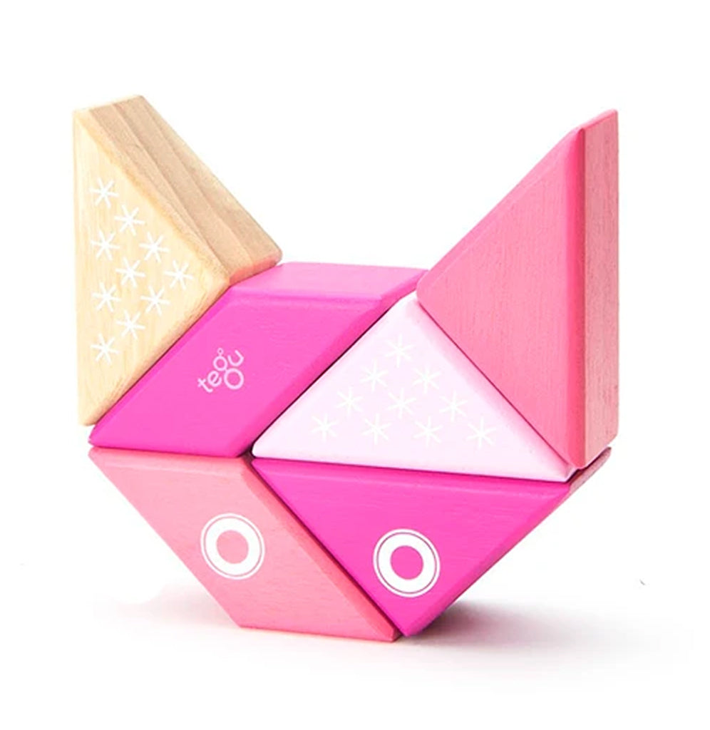Shades of pink, white and natural in triangles and parallelograms create a little kitty face.