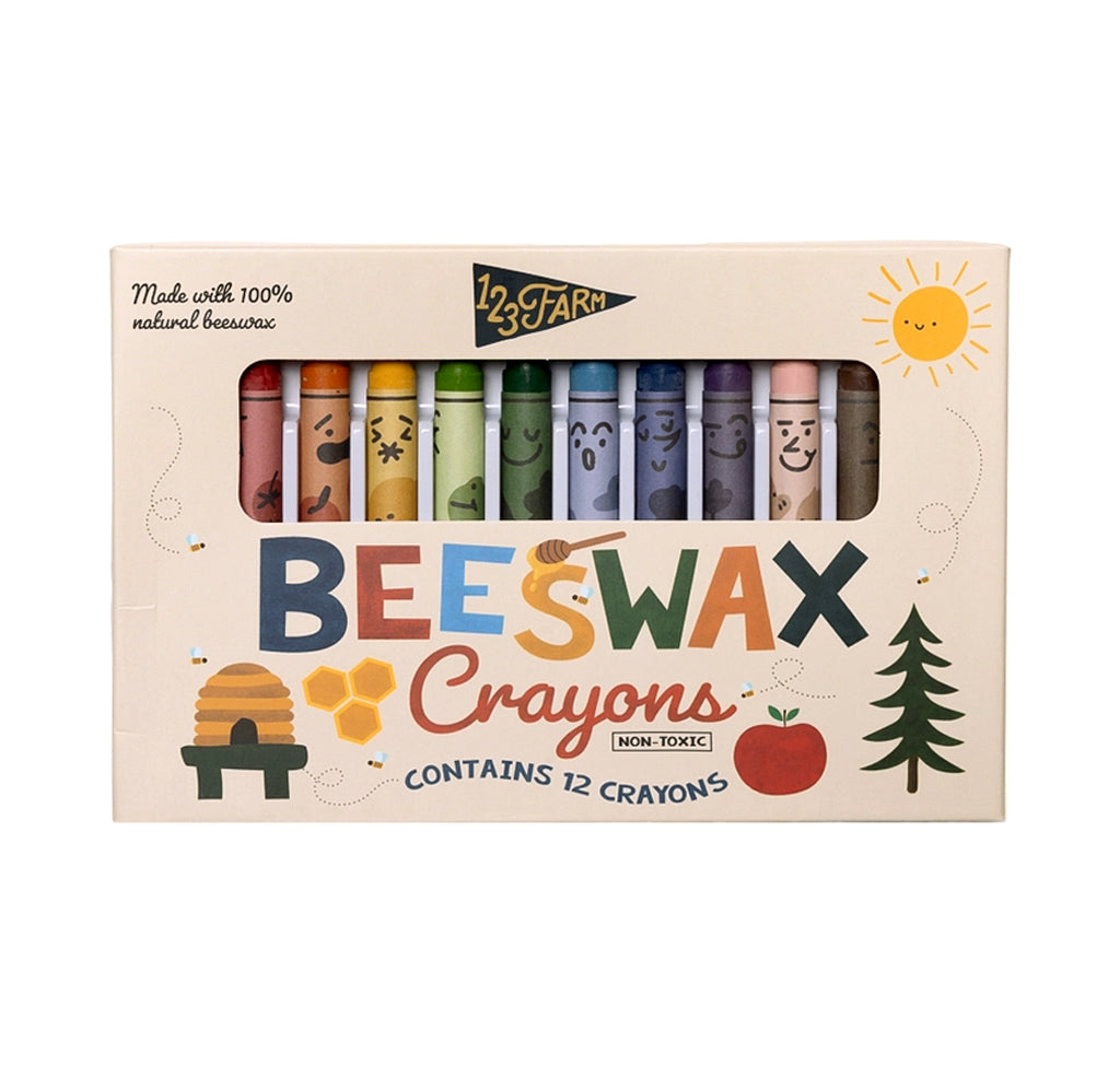 Colorful crayons with funny faces in a beige packaging 