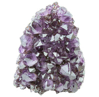 Amethyst crystal cluster on a white background