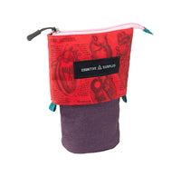 A zippered pouch with a red anatomical heart-patterned top half and a solid purple bottom half, featuring a black label that reads 'COGNITIVE SURPLUS'.