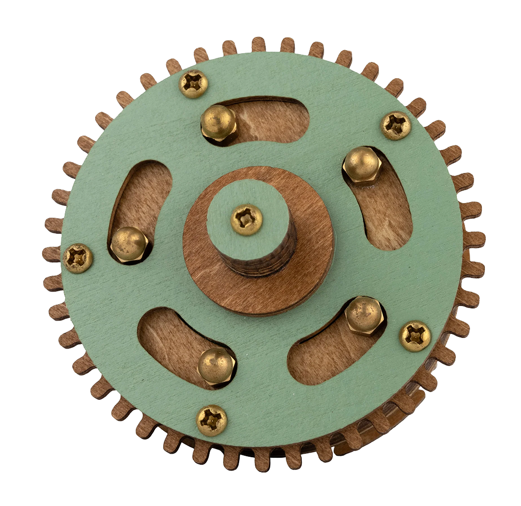 Wooden gear mechanism with a green circular plate, toothed rim, brass screws, curved cutouts, and a raised central hub on white.