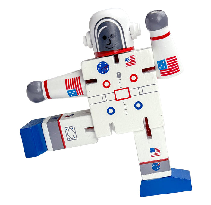 Toy astronaut figure with American flags on a white background