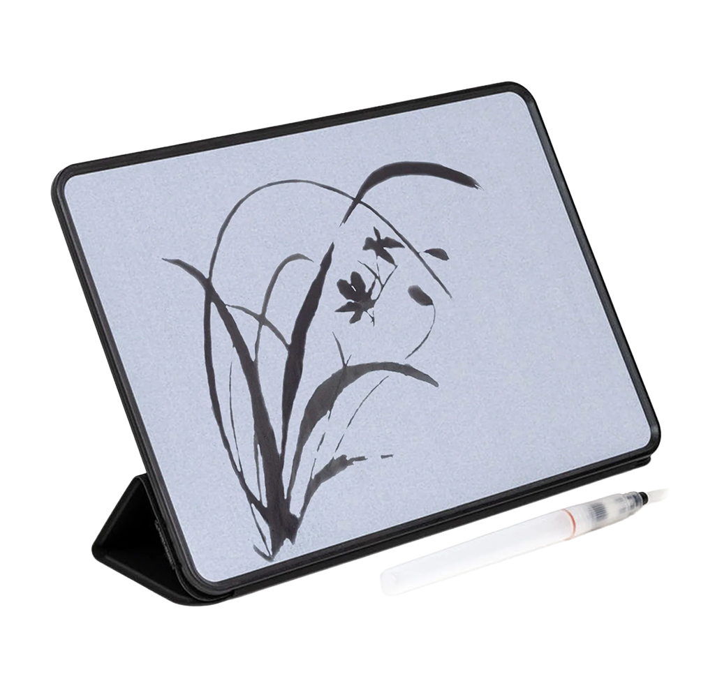 Black-framed digital drawing tablet displaying a delicate ink-style bamboo and flower sketch, with a white stylus beside it; calm minimalist scene.
