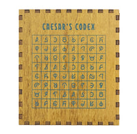 Wooden puzzle box with Caesar's Codex cipher grid on a white background