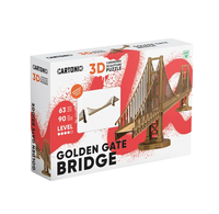A white-and-red Cartonic 3D cardboard sculpture puzzle box depicts a miniature Golden Gate Bridge, with “63 pieces” and “90 level” labels, against a plain background.
