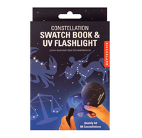Outer box packaging for the Kikkerland Constellation Swatch Book and UV Flashlight set. Packaging displays various constellation and the product in use. 