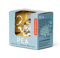 Kikkerland PEA wind-up mechanical toy in a light blue box, showing a white pea character and metal key through a window.
