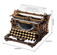 Ornate black-and-gold antique-style typewriter with round keys and a sheet of typed text, shown with dimensions; its craftsmanship feels elegant and nostalgic.