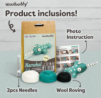Woolbuddy narwhal needle-felting kit with a photo instruction sheet, two needles, and white, teal, and black wool roving on a table. The playful display feels inviting.