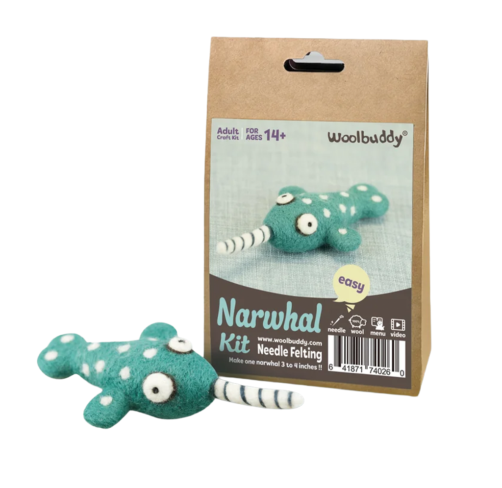 Woolbuddy Narwhal Needle Felting Kit packaging beside a finished teal, white-spotted narwhal plush; a playful craft project for ages 14 and up.