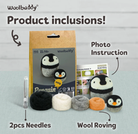 WoolBuddy penguin needle-felting kit display shows a boxed penguin, photo instructions, two needles, and four wool roving colors; cheerful product layout.