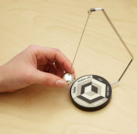 A hand grabbing the decision maker ball off to the side of the board. The board is divided into 3 quadrants with the options "Yes", "No Way", "Maybe", "Definitely", "Nope", and "Try Again."