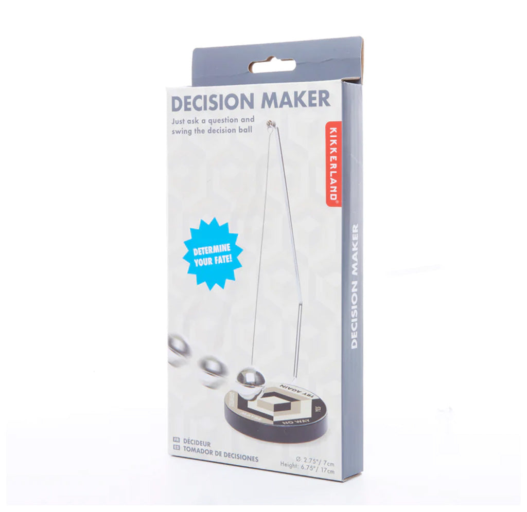 Packaging box for the decision maker that shows the item in action. "Determine Your Fate!" is written on the front of the package. 