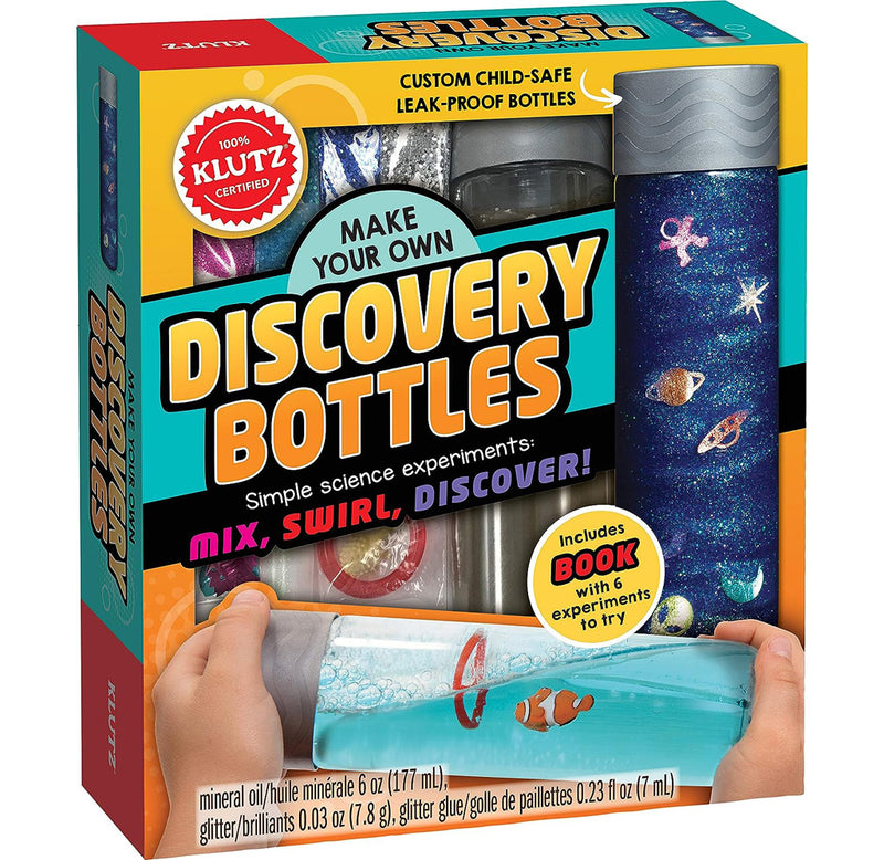 Front packaging of the Make Your Own Discovery Bottles kit with images of a sparkling dark blue space bottle and a turquoise sea bottle with a clownfish inside. There is a cutout on the front packaging that shows the contents in the kit. 