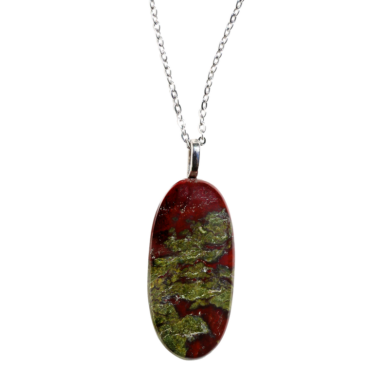 A reddish and green oval stone pendant on a silver chain.
