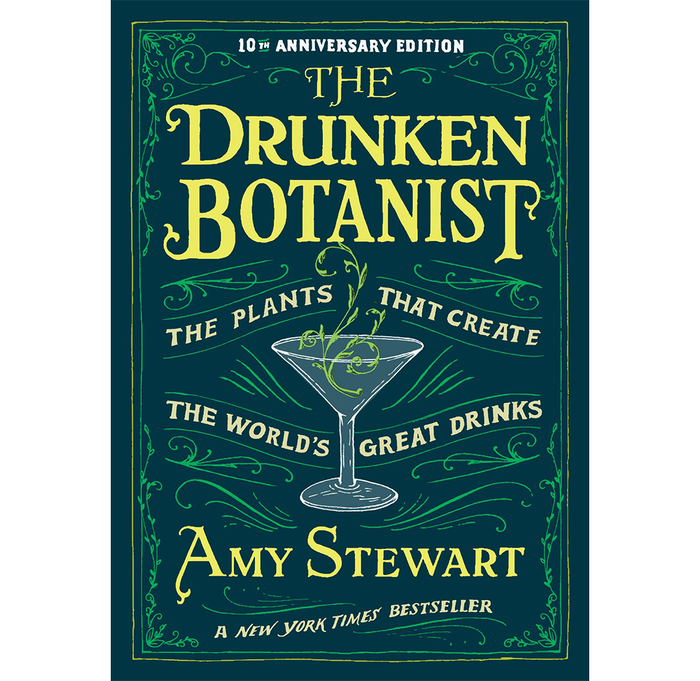 Front cover of the book 'The Drunken Botanist: The Plants That Create the World's Great Drinks' by Amy Stewart, 10th Anniversary Edition. The cover features a dark teal background with ornate green vine borders and large yellow title text, plus a white-and-green martini glass illustration in the center.