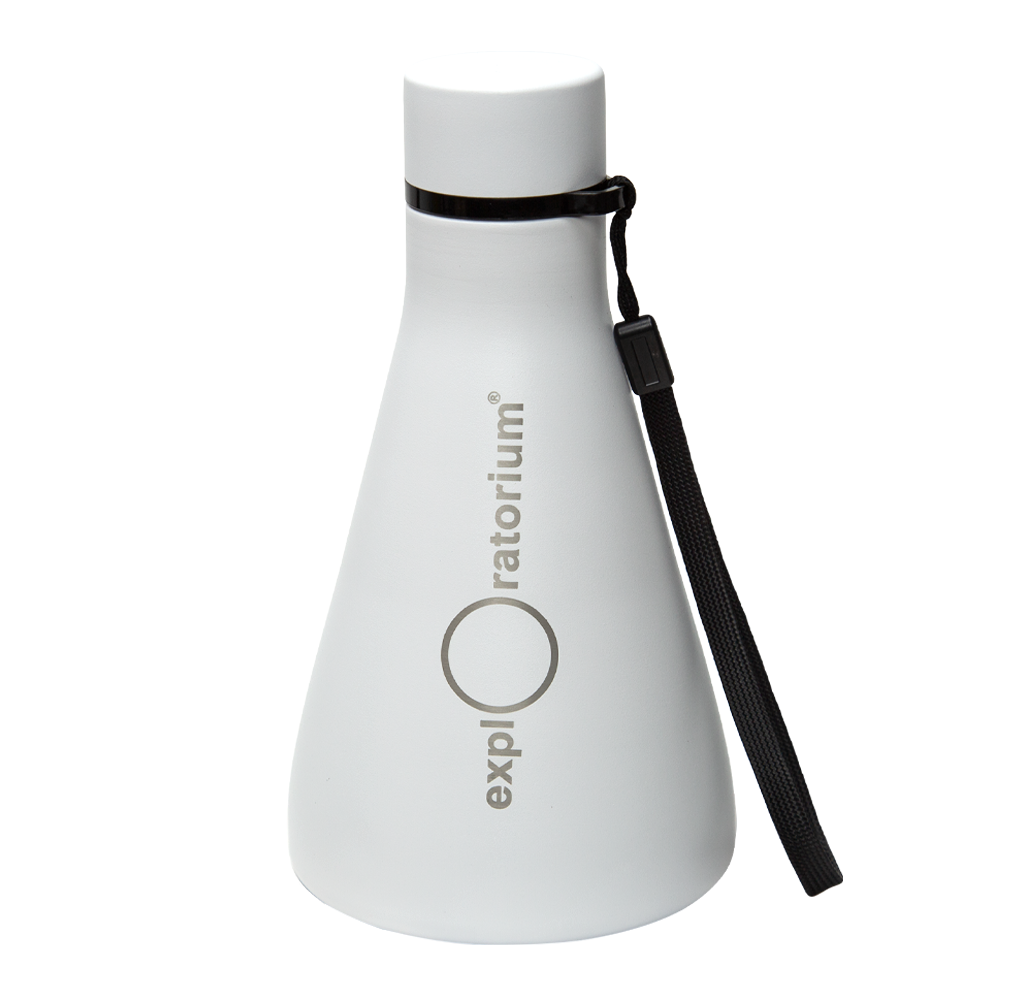 A white, Erlenmeyer flask shaped Exploratorium bottle with a black cap and wrist strap stands against a plain background, giving a clean, modern impression.