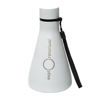A white, Erlenmeyer flask shaped Exploratorium bottle with a black cap and wrist strap stands against a plain background, giving a clean, modern impression.