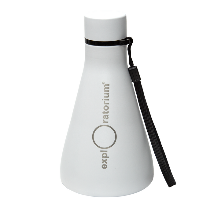 A white, Erlenmeyer flask shaped Exploratorium bottle with a black cap and wrist strap stands against a plain background, giving a clean, modern impression.