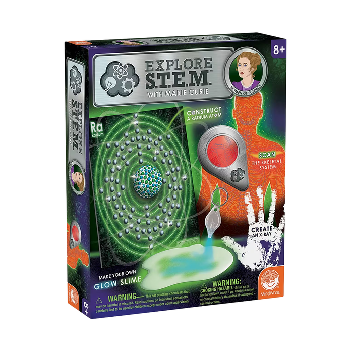 A green and purple “Explore STEM with Marie Curie” science kit for ages 8+, featuring a glowing atom, slime, and an X-ray scanner.