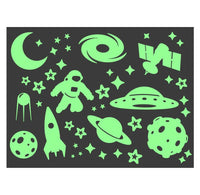 Glow-in-the-dark  space-themed stickers on a black background