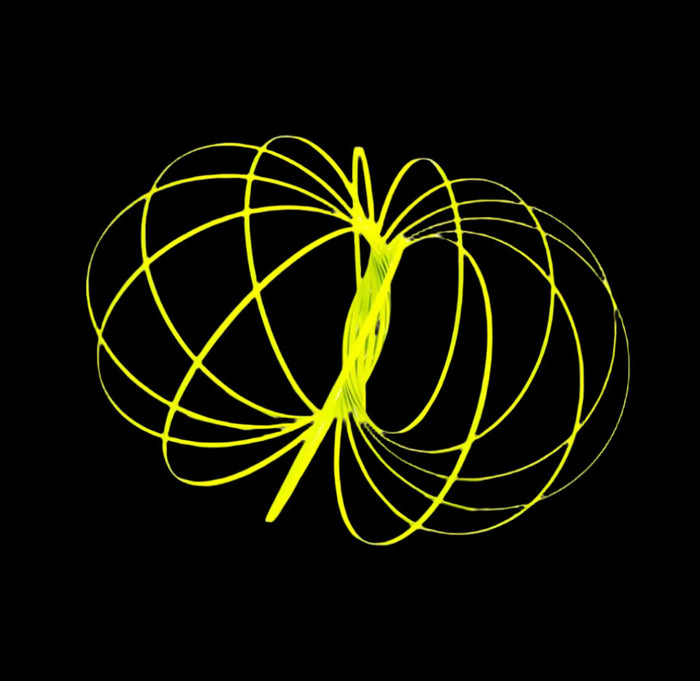 Yellow circular spring on a black background