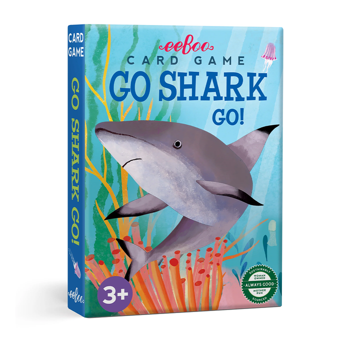 Boxed children’s card game titled “Go Shark Go!” features a large smiling gray shark swimming through bright coral and seaweed; playful underwater artwork and a 3+ age mark.