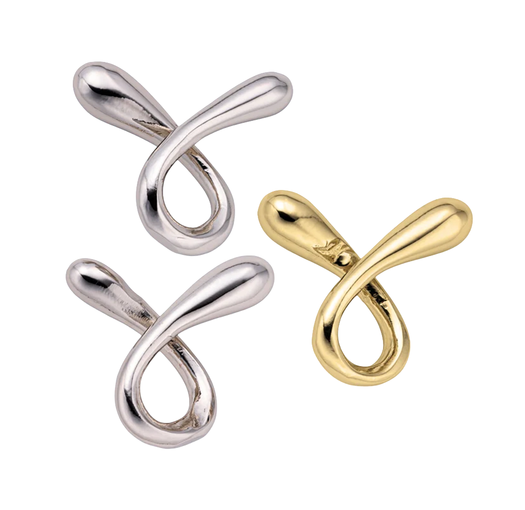 Three polished looped metal puzzle pieces—two silver and one gold—cross in a teardrop shape on white.