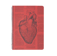 Red spiral bound notebook cover with anatomical heart illustration.