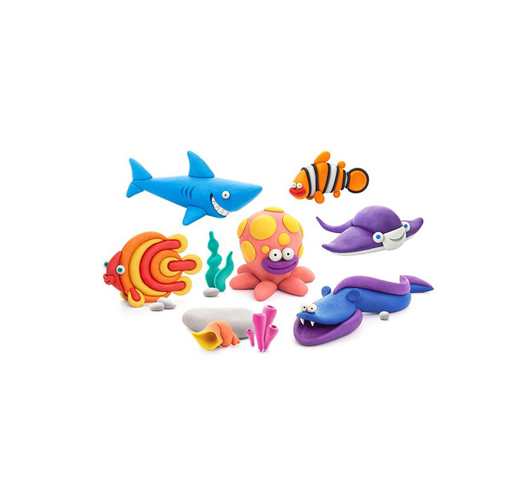 Image of a sculpted shark, clownfish, discus fish, octopus, stingray, and eel from the kit. 