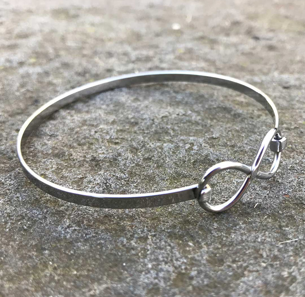 3/4 view of silver infinity bracelet.