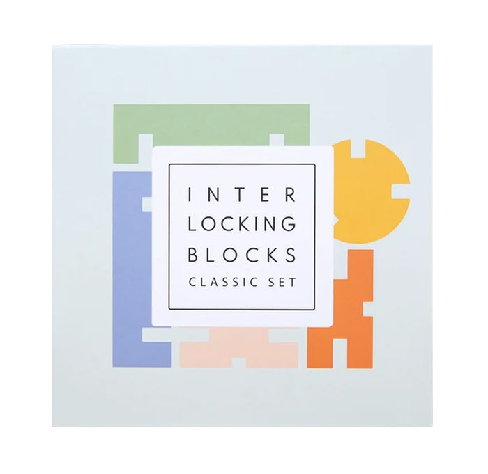 The product packaging for the 'Interlocking Blocks Classic Set' shows a white square box with a minimalist graphic of colorful interlocking puzzle-like blocks in green, blue, yellow, orange, and pink on a very light gray background.