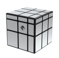 Metallic silver 3D puzzle cube with black grid lines and a geometric logo, isolated on white; sleek, modern, industrial tone.
