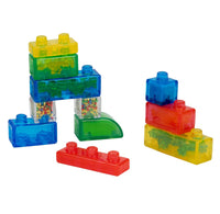 Colorful translucent toy building blocks filled with small multicolored beads, arranged on a plain white background.