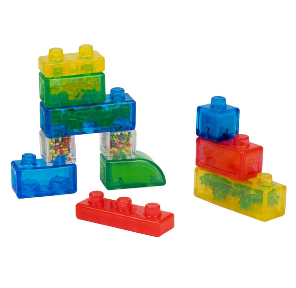 Colorful translucent toy building blocks filled with small multicolored beads, arranged on a plain white background.