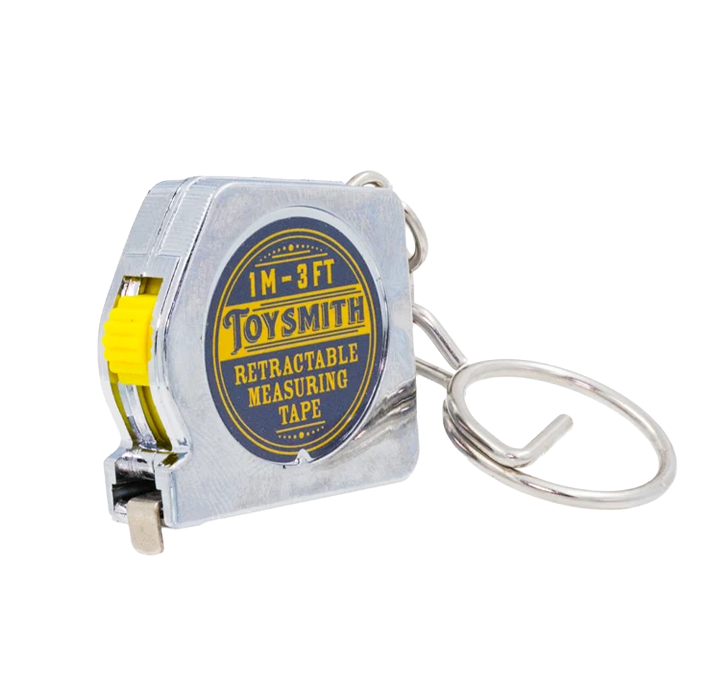 A small silver Toysmith 3-foot retractable measuring tape with a bright yellow slider and metal key ring, isolated on white; practical and playful.