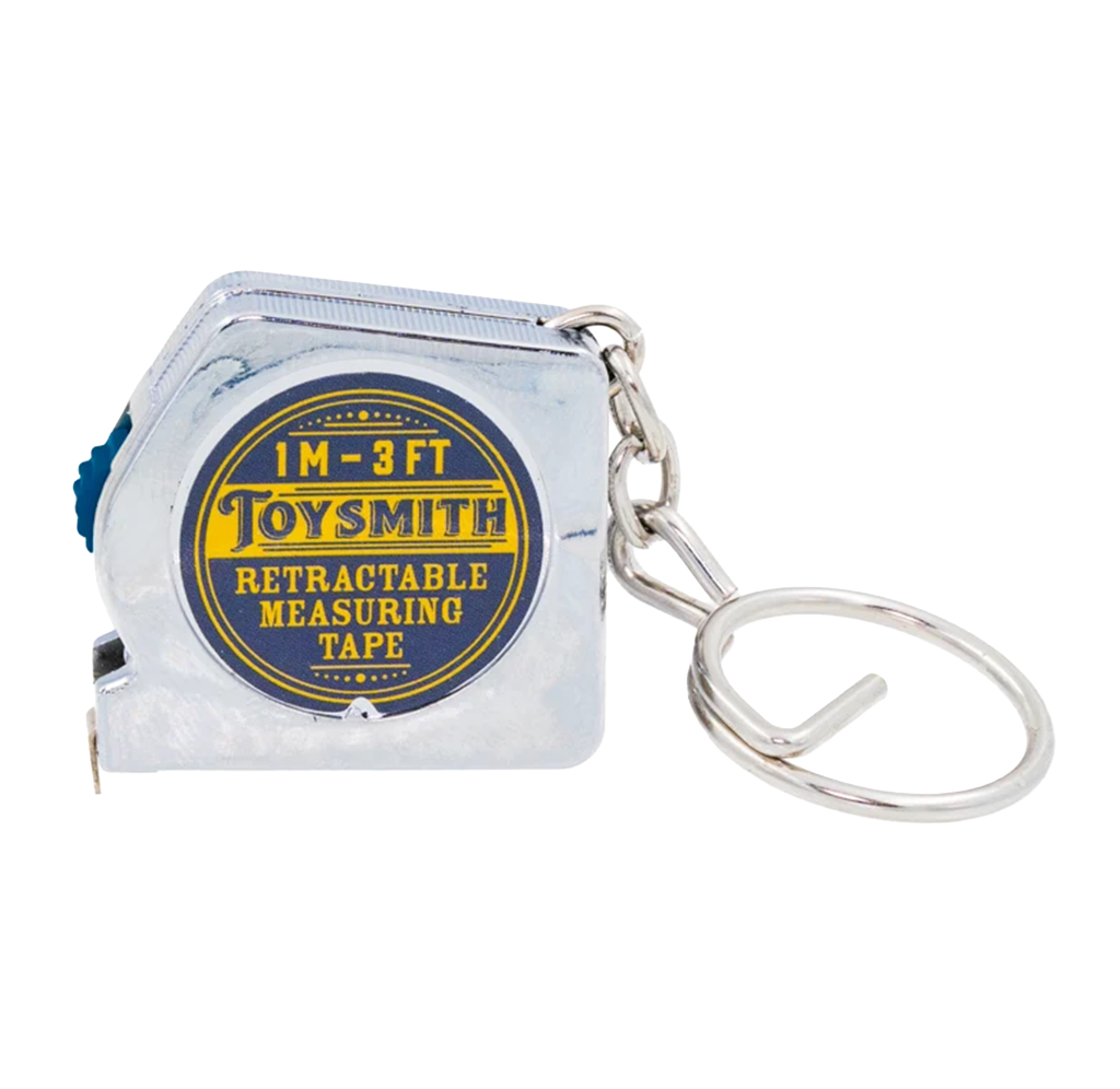 A compact silver Toysmith retractable measuring tape labeled “1 m–3 ft,” attached to a metal key ring; a practical, portable tool on a white background.