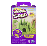 Purple Kinetic Sand box with neon green sand molded into a castle, dolphin, and sea shapes; colorful packaging highlights reusable, never-drying play.