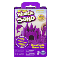 A purple Kinetic Sand package shows a squeezable neon-purple sandcastle and sand beside it, suggesting playful, creative fun for children.