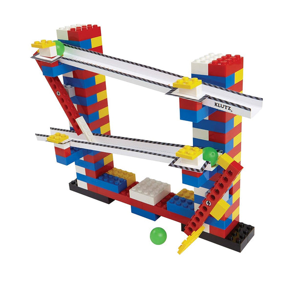 An example of a chain reaction with red, blue and yellow LEGOS, white ramps and two green balls.