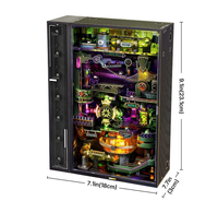 Black rectangular marble run cabinet shown open at the front, glowing with colorful gears, ramps, and lights; labeled dimensions show its compact size.
