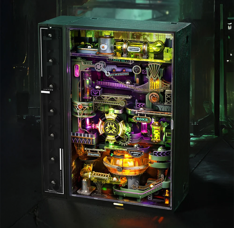 A tall black glass-fronted marble run glows with neon gears, pipes, gauges, and colorful machinery in a dark industrial setting, creating a futuristic, mysterious mood.