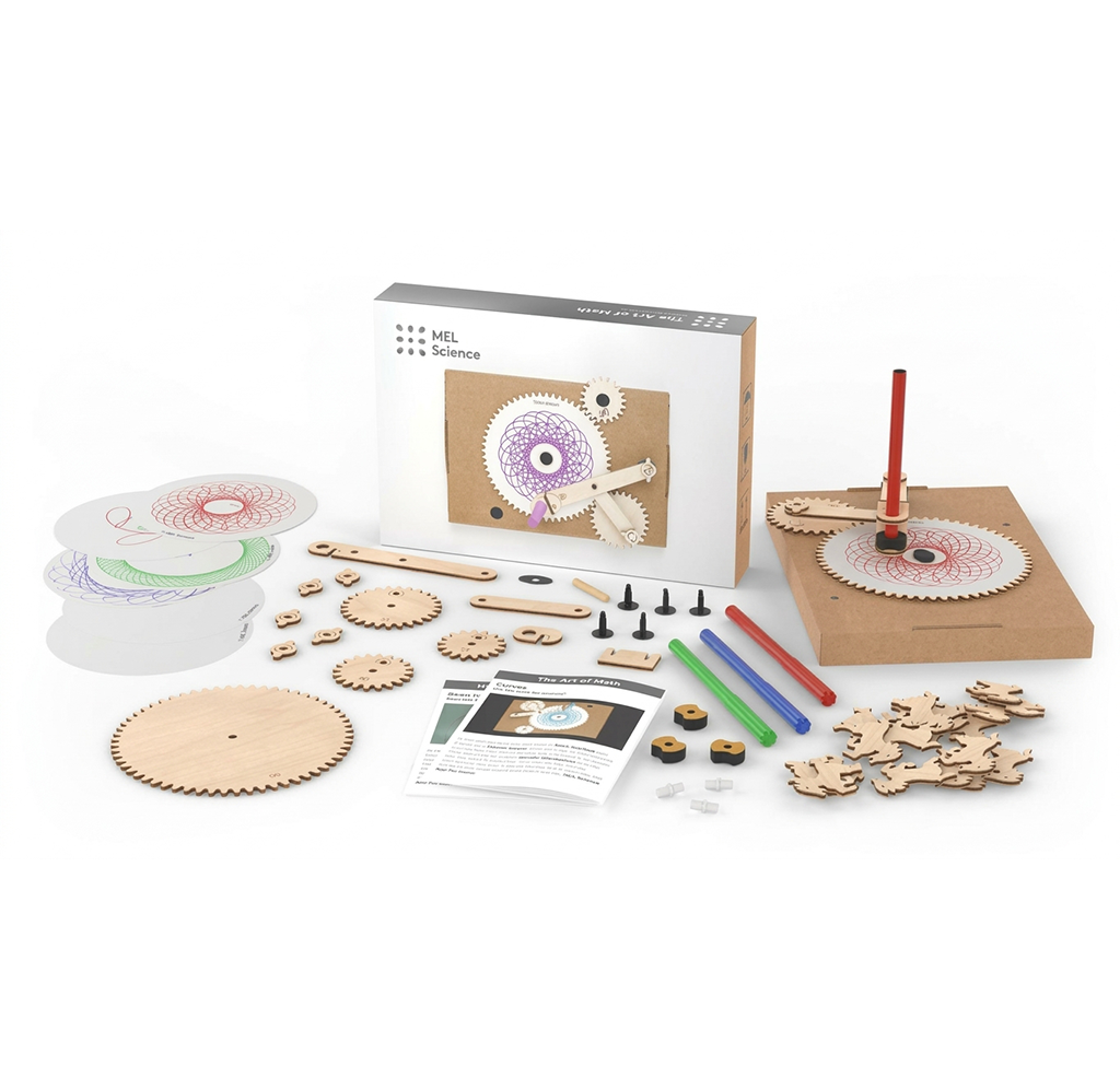 A MEL Science gear-making kit is spread out on a white surface, with wooden cogs, colorful discs, tools, and instructions; the hands-on science set feels playful and educational.