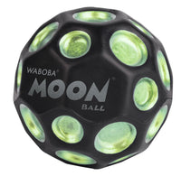 Black Waboba Moon Ball with green reflective surface on a white background