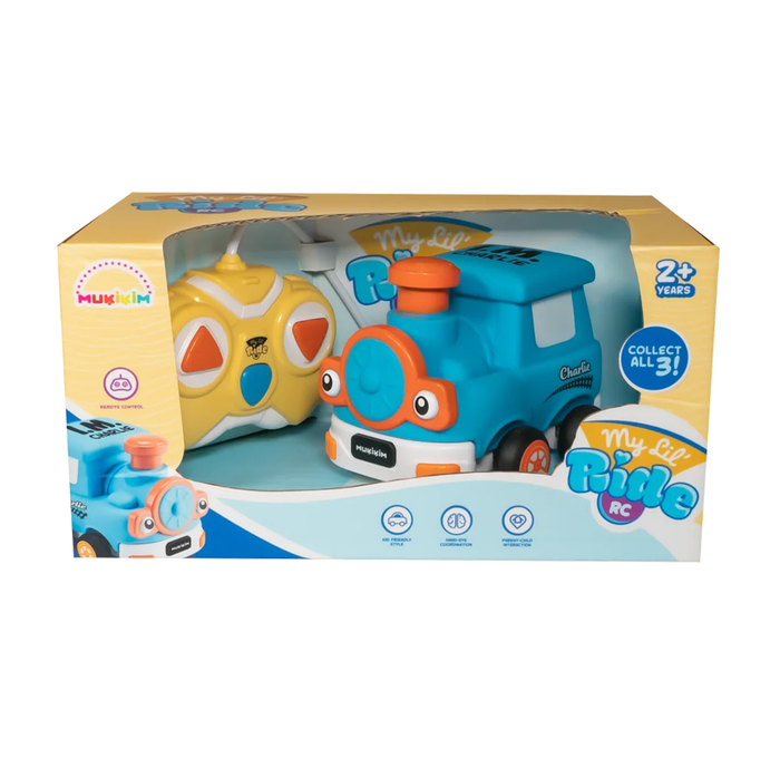 A boxed toy set features a smiling turquoise bus with an orange button and a yellow character behind it; colorful packaging feels playful and cheerful.