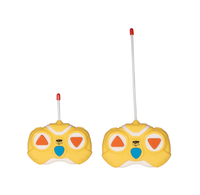 Two yellow handheld remote controls for a toy, each with a long antenna, red tip, orange buttons, and a blue center button, shown against a white backgroun