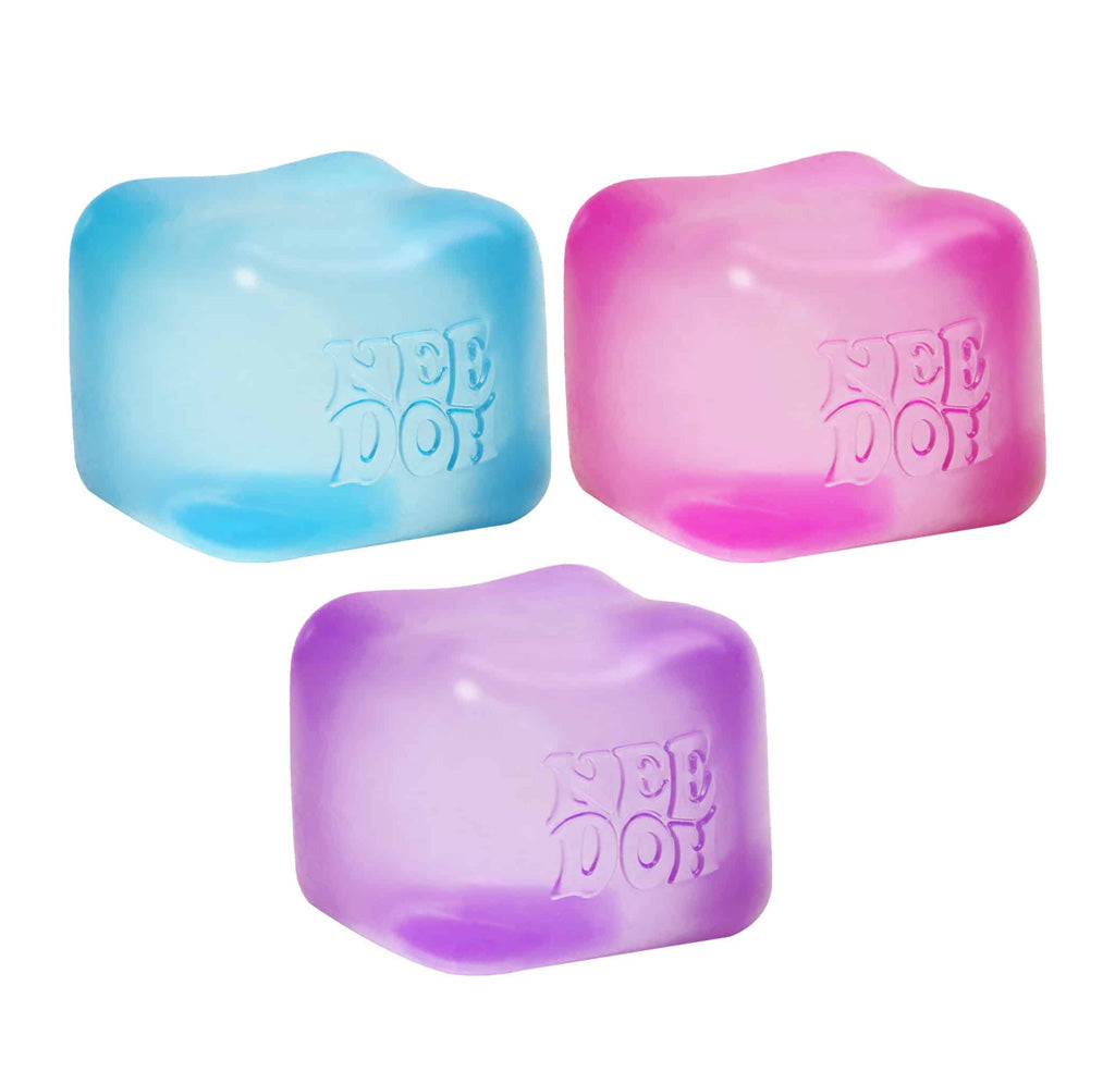Three colorful cube shaped toys with 'Nee Doh' branding on a white background